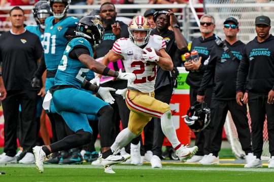 San Francisco 49ers running back Christian McCaffrey (23) runs after a catch against Jacksonville Jaguars linebacker Yasir Abdullah (56) during the second half at Levi's Stadium.