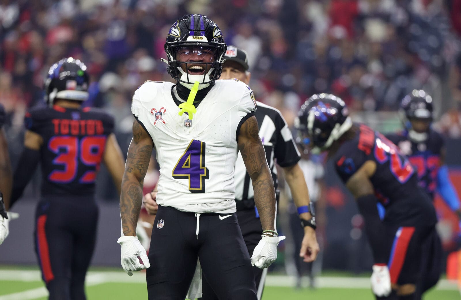 Dec 25, 2024; Houston, Texas, USA; Baltimore Ravens wide receiver Zay Flowers (4) reacts after his first down catch against the Houston Texans in the first quarter at NRG Stadium.