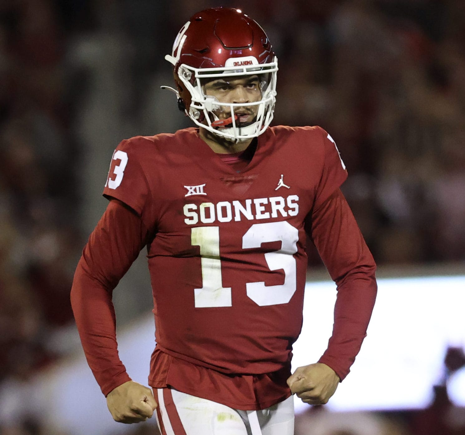 Oklahoma Sooners quarterback Caleb Williams pumps his fists below his waist after throwing a touchdown pass against TCU.