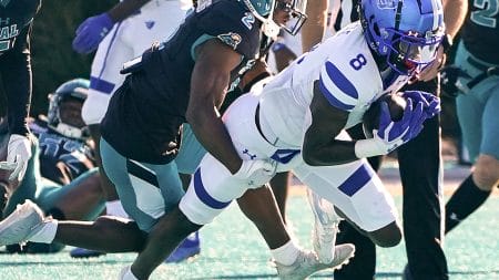 Nov 13, 2021; Conway, South Carolina, USA; Coastal Carolina Chanticleers cornerback D'Jordan Strong (2) tackles Georgia State Panthers wide receiver Ja'Cyais Credle (8) at Brooks Stadium. Mandatory Credit: David Yeazell-USA TODAY Sports